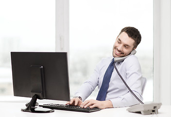 Image showing smiling businessman or student with computer