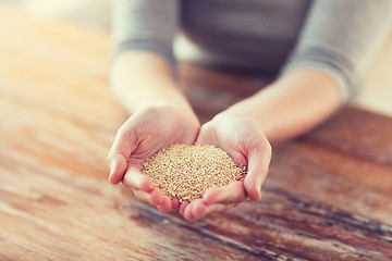 Image showing cloes uo of female cupped hands with quinoa