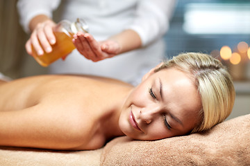 Image showing close up of woman lying on massage table in spa