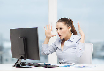 Image showing stressed woman with computer