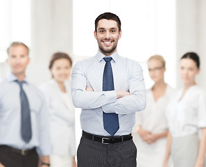 Image showing handsome businessman with crossed arms