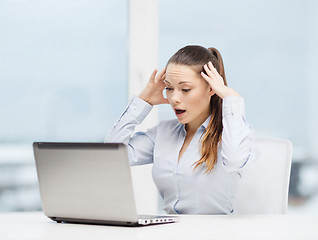 Image showing stressed woman with laptop