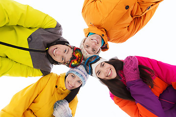 Image showing happy friends in ski goggles outdoors