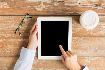 Image showing close up of female hands with tablet pc and coffee