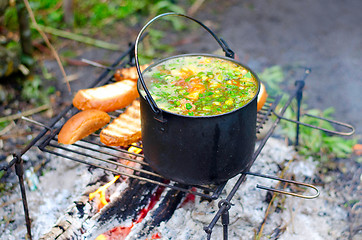 Image showing The cooking of soup on the fire