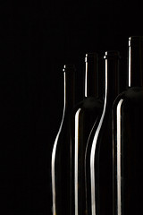 Image showing Silhouettes of elegant wine bottles