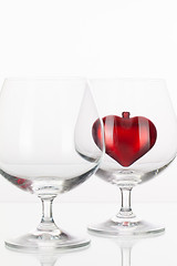 Image showing Red heart inside a glass of cognac 