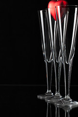 Image showing Three champagne glasses and red heart