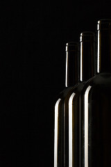 Image showing Silhouettes of elegant wine bottles