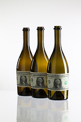 Image showing Empty bottles of wine from the label of dollar bill 