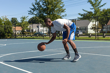 Image showing Basketball Player Dribbling