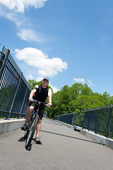 Image showing Man Riding a Bike