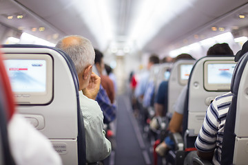 Image showing Passengers on the airplane.