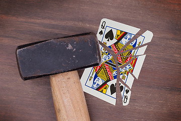 Image showing Hammer with a broken card, queen of spades