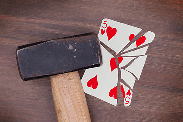 Image showing Hammer with a broken card, five of hearts