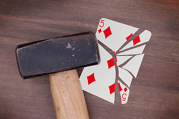 Image showing Hammer with a broken card, five of diamonds