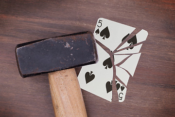 Image showing Hammer with a broken card, five of spades