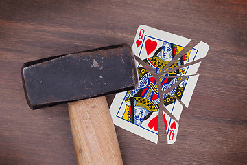 Image showing Hammer with a broken card, queen of hearts