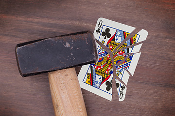 Image showing Hammer with a broken card, queen of clubs