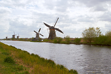 Image showing Traditional dutch windmill near the canal. Netherlands