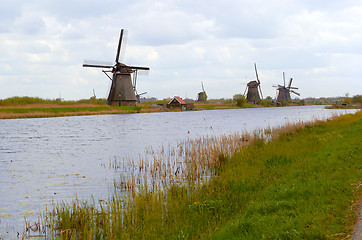 Image showing Traditional dutch windmill near the canal. Netherlands