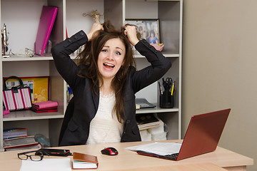 Image showing Girl in the office tearing my hair out