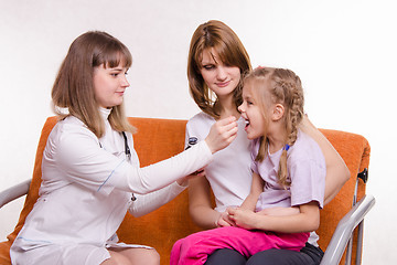 Image showing Pediatrician at home gives you a sick child medicine