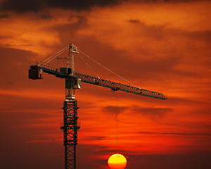 Image showing Construction Crane Hoisting the Sun