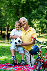 Image showing grandfather and child have fun  in park