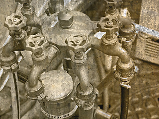 Image showing faucets at a road works in vinatage look