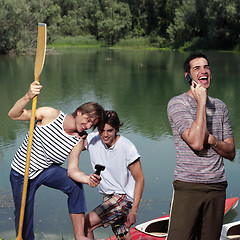 Image showing happy men with canoe