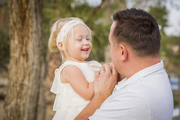 Image showing Father Playing With Cute Baby Girl Outside at the Park
