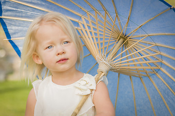 Image showing Cute Baby Girl Holding Parasol Outside At Park