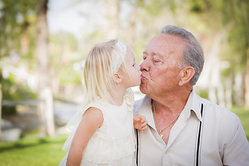 Image showing Grandfather and Granddaughter Kissing At The Park