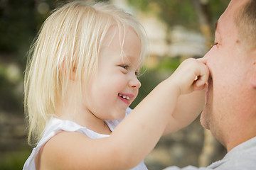 Image showing Father Playing With Cute Baby Girl Outside at the Park