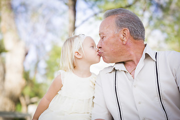 Image showing Grandfather and Granddaughter Kissing At The Park