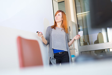 Image showing Businesswoman giving a talk.