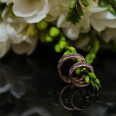 Image showing Two wedding rings in infinity sign. Love concept.