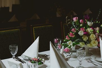 Image showing Beautiful flowers on table