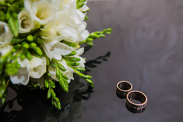 Image showing Two wedding rings in infinity sign. Love concept.