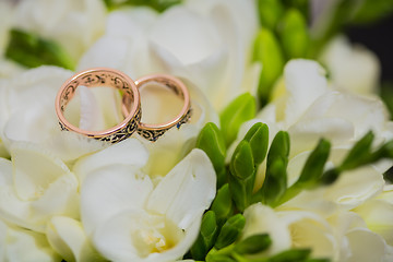Image showing Two wedding rings in infinity sign. Love concept.