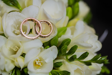 Image showing Two wedding rings in infinity sign. Love concept.