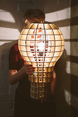 Image showing Hanging, wooden light shade lamp with bulb