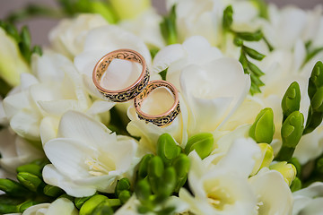 Image showing Two wedding rings in infinity sign. Love concept.