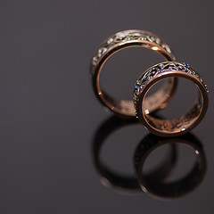 Image showing Two wedding rings in infinity sign. Love concept.