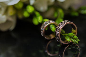 Image showing Two wedding rings in infinity sign. Love concept.