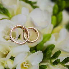 Image showing Two wedding rings in infinity sign. Love concept.