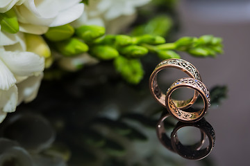 Image showing Two wedding rings in infinity sign. Love concept.