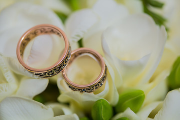 Image showing Two wedding rings in infinity sign. Love concept.