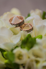 Image showing Two wedding rings in infinity sign. Love concept.